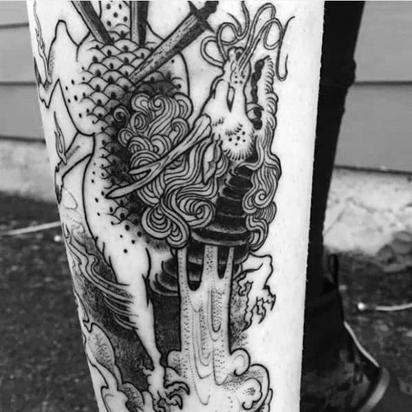 Blackwork Kirin tattoo on the leg with bold lines and dotwork shading, featuring a fierce face, flowing mane, and dynamic flame elements.