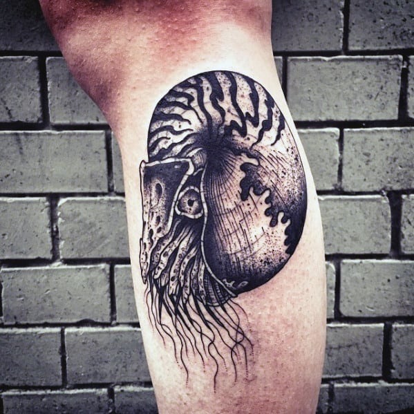 Guy With Leg Ammonite Tattoo Design
