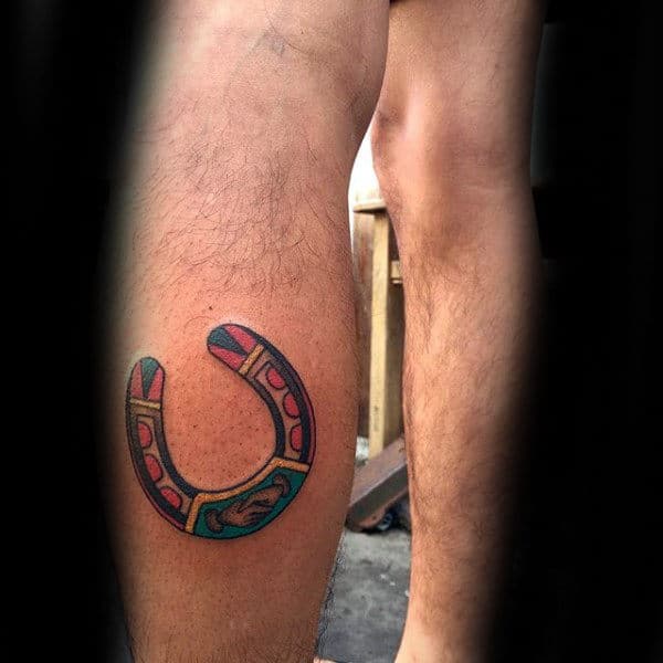Guy With Leg Calf Tattoo Design Of Horseshoe