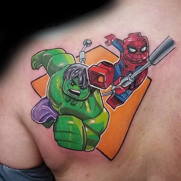 Vibrant tattoo of Lego Hulk and Spider-Man in action poses, set against an orange geometric background on the shoulder blade.