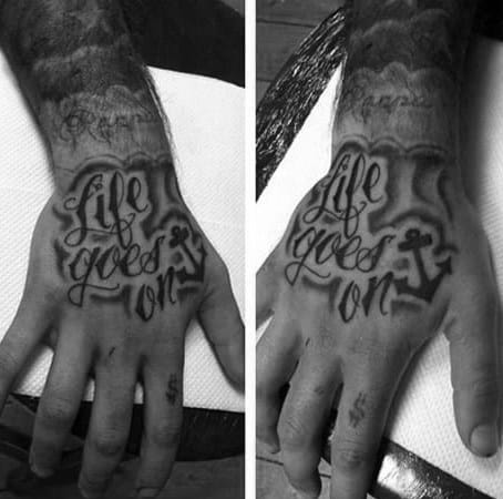 Guy With Life Goes On Hand Tattoo Design