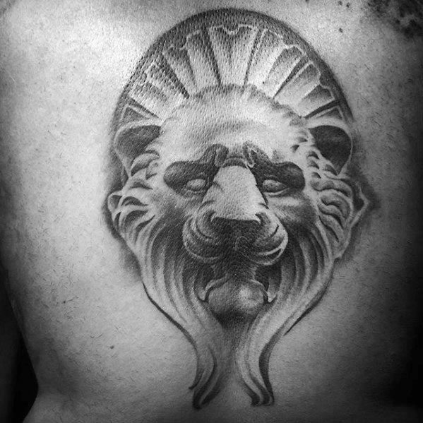 Guy With Lion Statue Back Tattoo Design