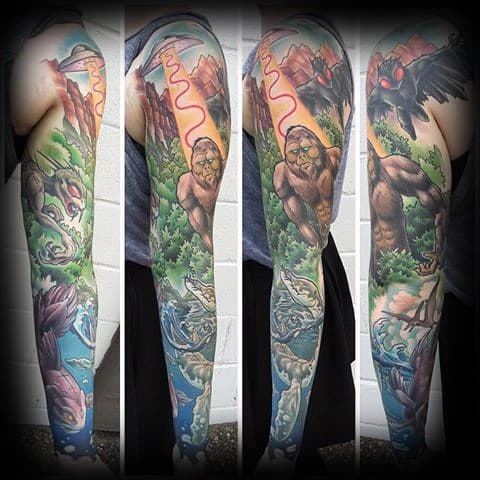 Guy With Loch Ness Monster Tattoo Design Full Arm Sleeve