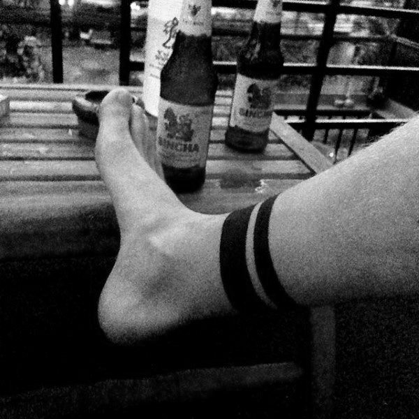 Guy With Lower Leg Black Band Tattoo Design