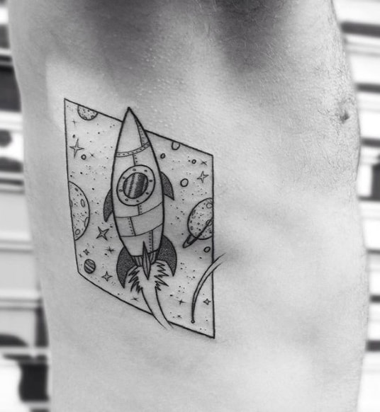 Guy With Masculine Rocket Ship Rib Cage Side Tattoo