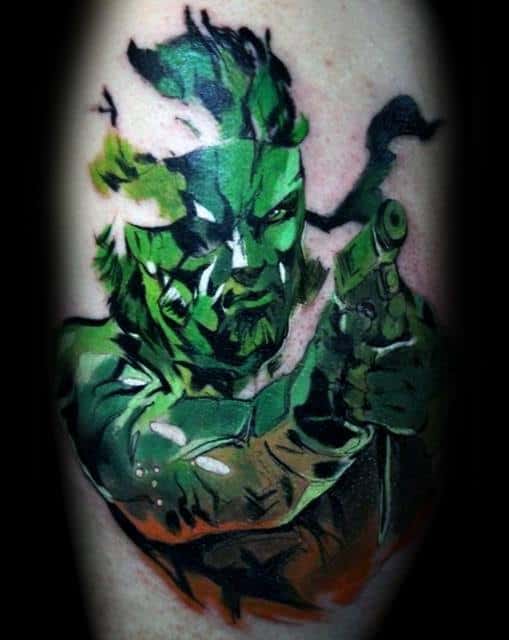 Guy With Metal Gear Tattoo Design Green And Orange Ink Leg Calf