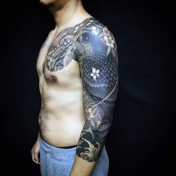 Guy With Modern Full Sleeve And Shoulder Tattoo Of Hawk Adorned With Flowers