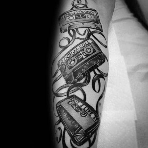 Guy With Multiple Cassette Tapes Tattoo On Legs
