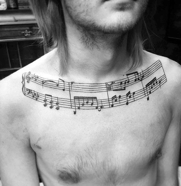 Guy With Music Staff Collar Bone Tattoo Design