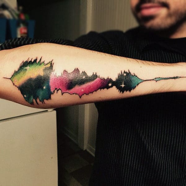 Guy With Musical Waves Tattoos Outer Forearm