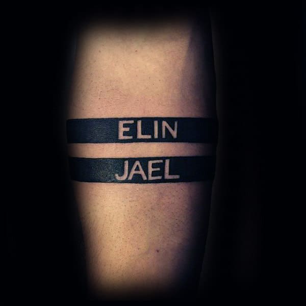 Guy With Name Black Band Negative Space Tattoo