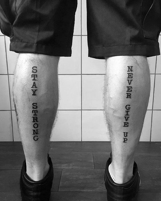 Guy With Never Give Up Tattoo Design On Back Of Legs