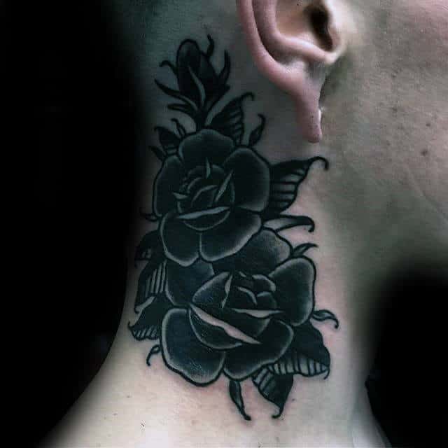 Neck tattoo of dark roses with leaves