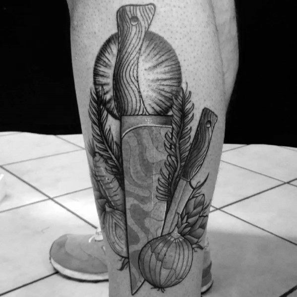 Black and grey leg tattoo featuring a detailed composition of knives, onions, and herbs, blending realism with intricate shading and fine linework.