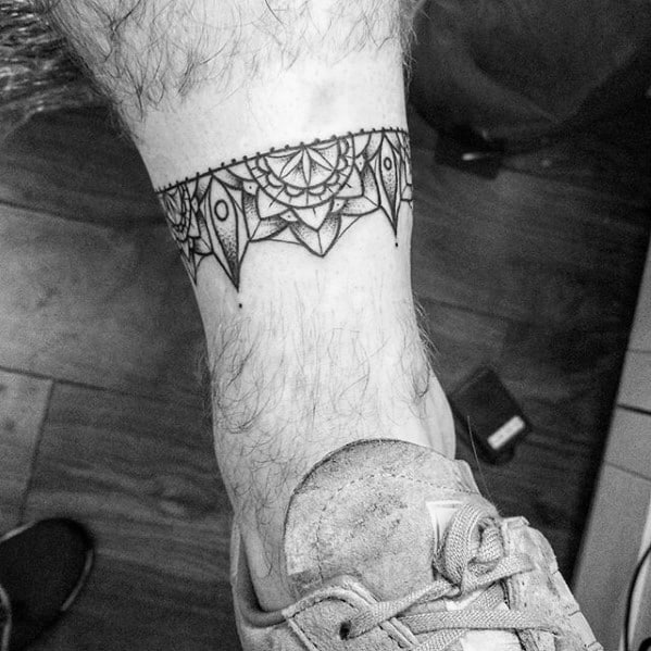 Guy With Ornate Ankle Band Tattoo Design