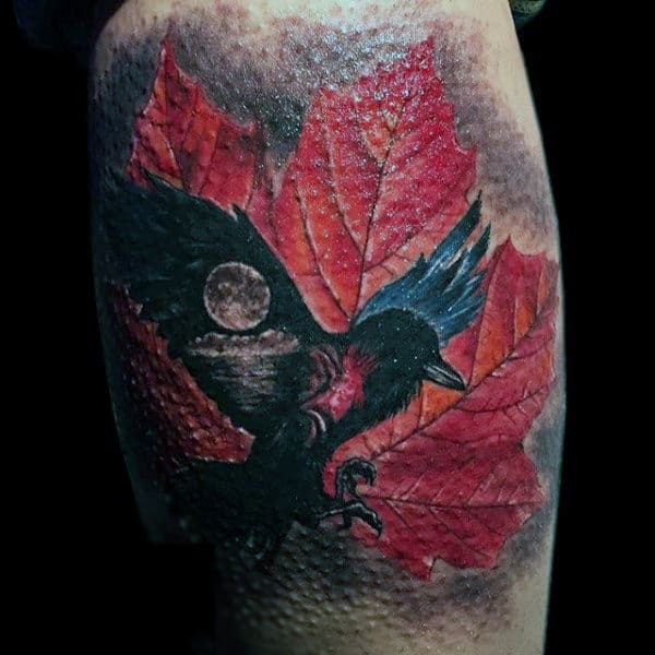 Guy With Pink Leaves And Raven Tattoo On Arms