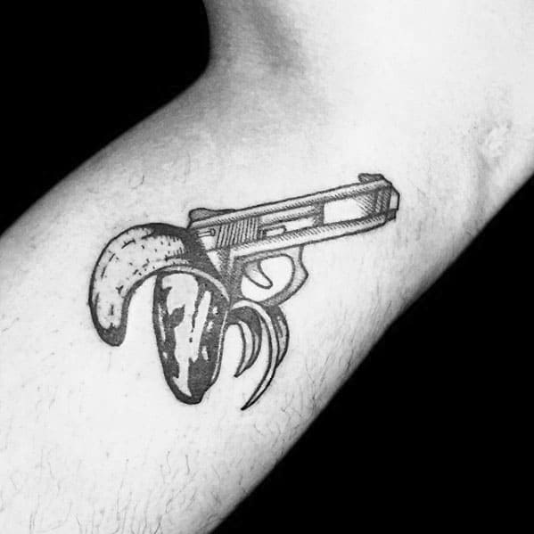 Guy With Pistol Banana Tattoo Design