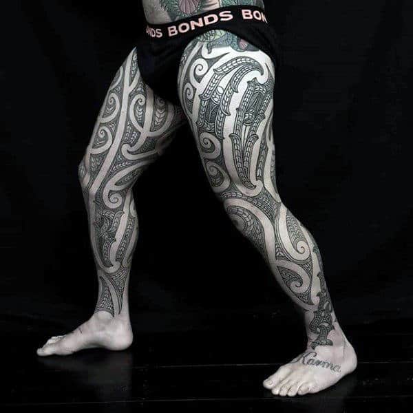 Guy With Polynesian Full Leg Sleeve Tribal Thigh Tattoo Designs