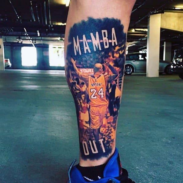 A vibrant tattoo of Kobe Bryant with the words "Mamba Out" as he walks off the court, displaying his Lakers jersey with number 24, set against a fiery background.