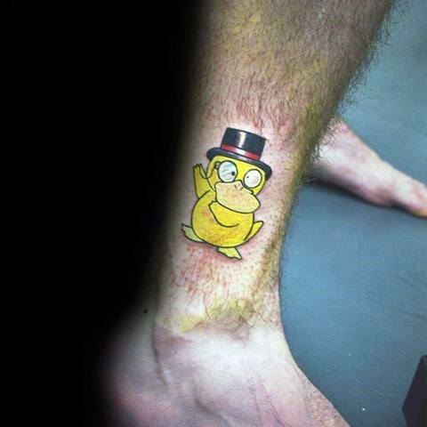 Quirky Psyduck tattoo wearing a monocle and top hat, adding a classy twist to the character, placed on a man's lower leg.