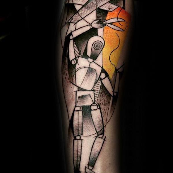 Abstract puppet tattoo with geometric shapes and a marionette figure hanging by strings, accented by a bold orange-yellow background.
