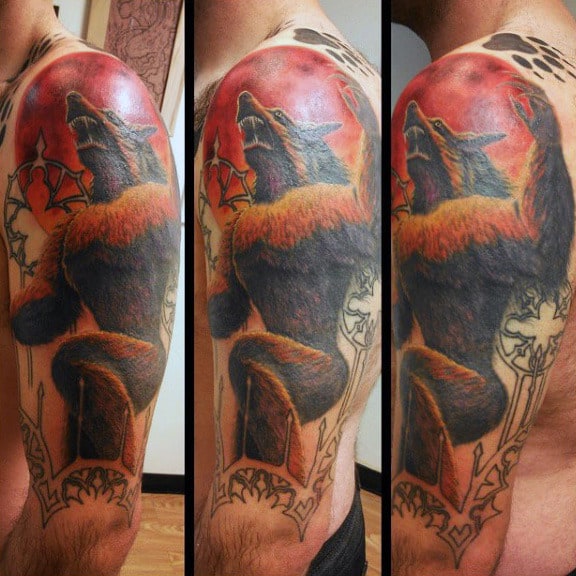 Guy With Raging Red Sun And Werewolf Tattoo Arms