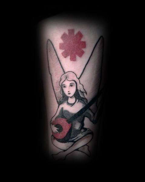 Tattoo featuring a winged angel playing a guitar, with the Red Hot Chili Peppers logo above, blending soft shading and bold symbolism.
