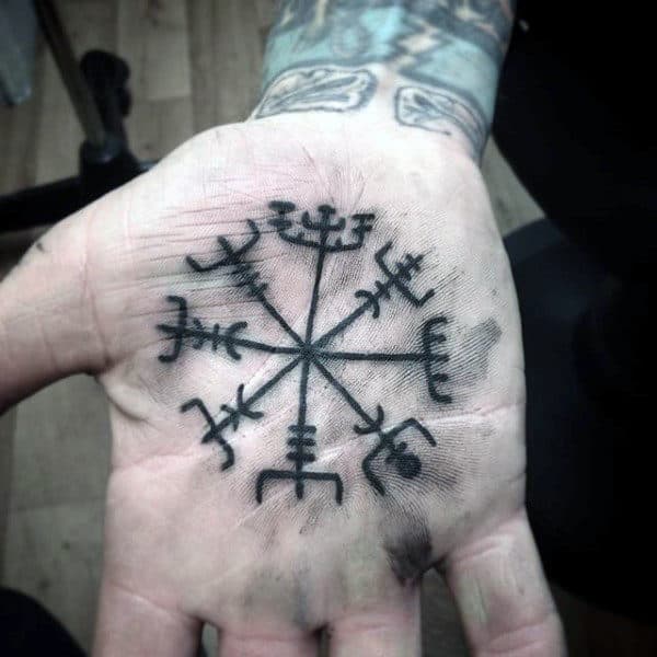 Guy With Religious Symbol Tattoo On Palm