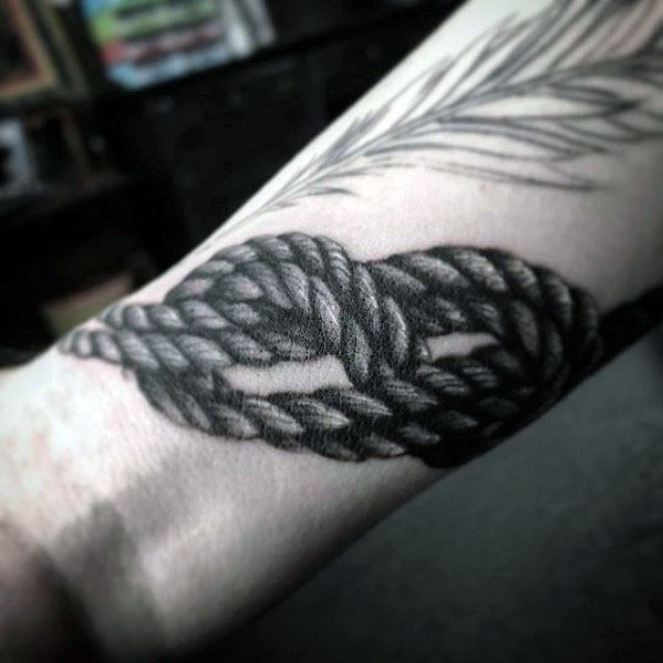 Guy With Rock Climbing Rope Wrist Tattoo Design