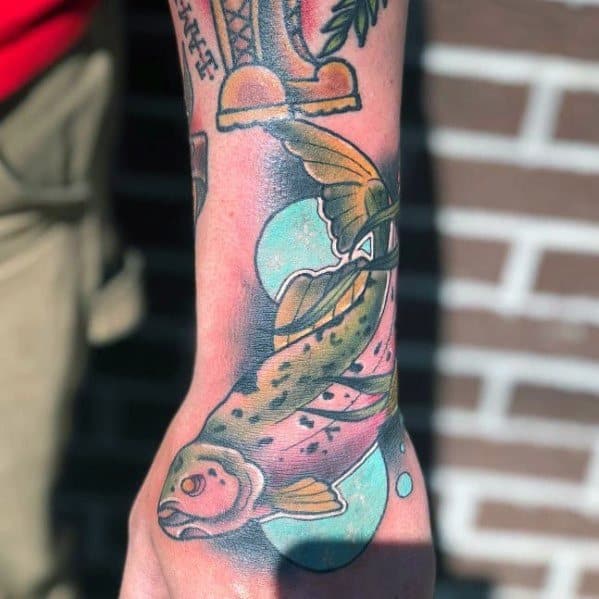 Colorful tattoo of a leaping salmon with flowing fins and water bubbles, blending soft pastel tones for a dynamic and artistic wrist design.