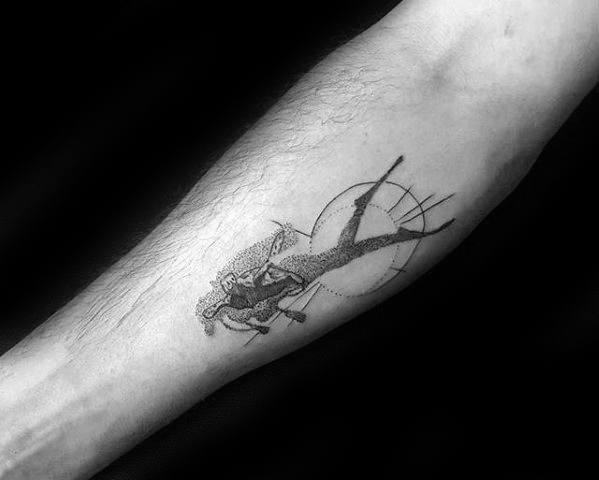 Scuba diver tattoo design on forearm with geometric circle elements and detailed dotwork shading.