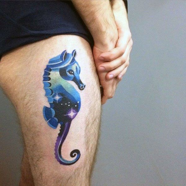 Galaxy-themed seahorse tattoo on thigh, featuring vibrant blue and purple hues with starry details for a cosmic and dreamy aesthetic.