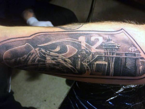 Guy With Seattle Skyline Outer Forearm Tattoo