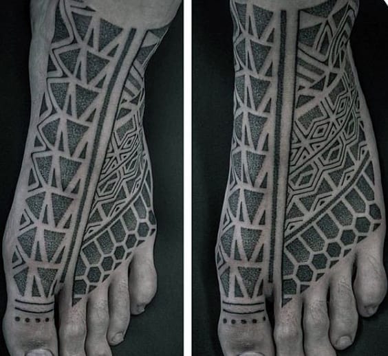 Black geometric tattoos on both feet, featuring intricate patterns of lines, triangles, and hexagons