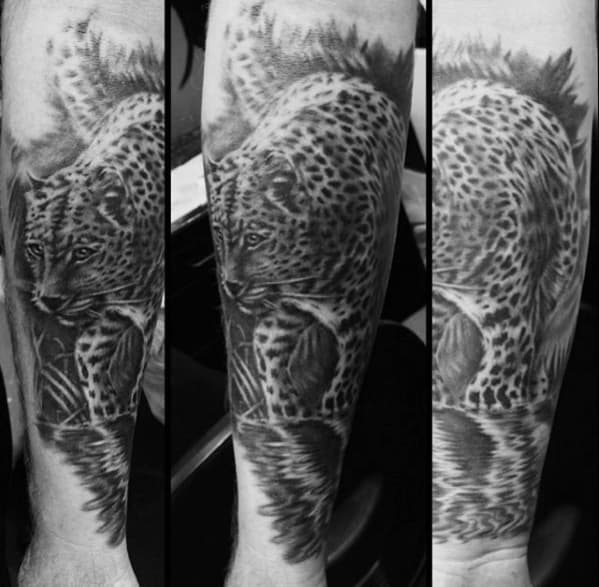 Guy With Shaded Black And Grey Cheetah Tatto Design On Forearm