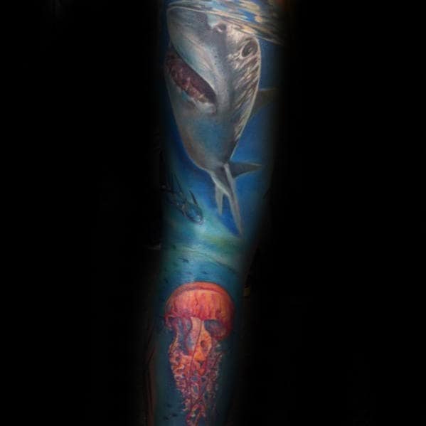 Guy With Shark And Jellyfish Ocean Sleeve Tattoo
