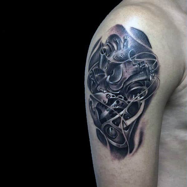 Guy With Shiny Steampunk Tattoos On Upper Arm
