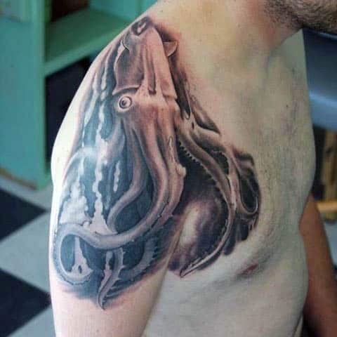 Guy With Shoulder Squid Tattoo In Black Ink