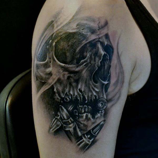 Guy With Skull And Bullet Tattoo On Upper Arm