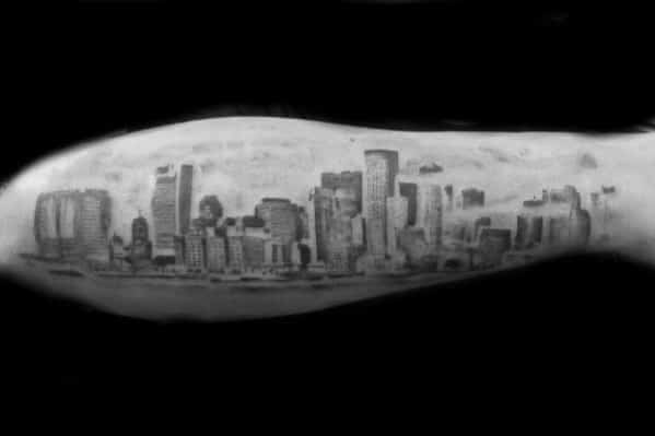 Guy With Skyline Outer Forearm Black And Grey Ink Shaded Tattoo Design
