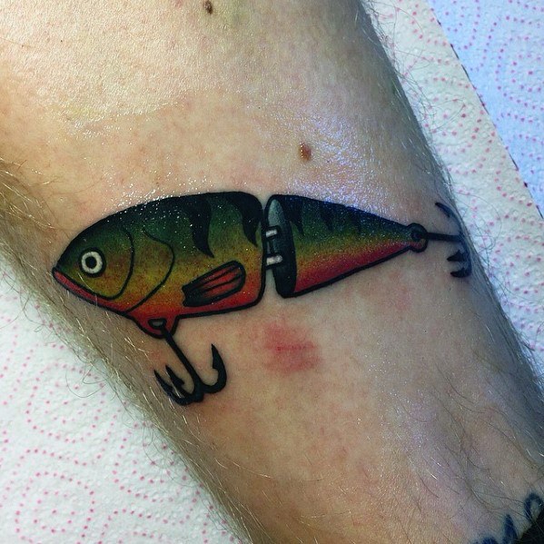 Guy With Small Detailed Fish Lure Hook Forearm Tattoo