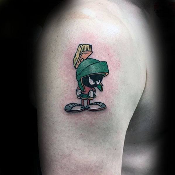 Guy With Small Simple Marvin The Martian Upper Arm Tattoo