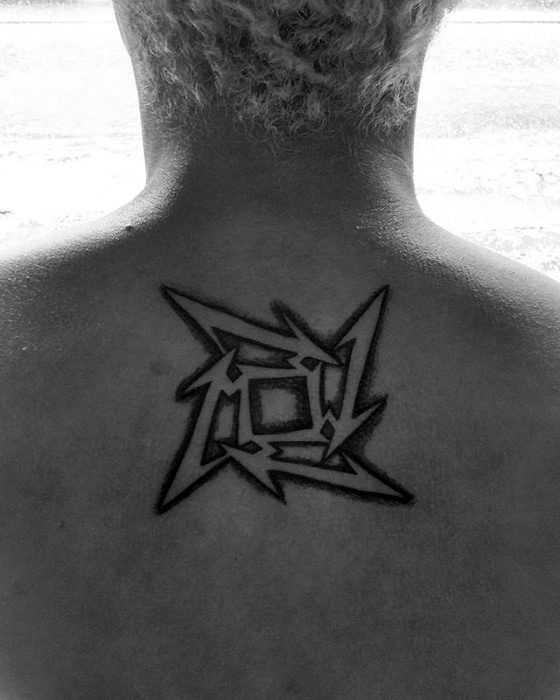 Black ink Metallica ninja star logo tattoo centered on the upper back, featuring sharp edges and bold lines in a clean design.