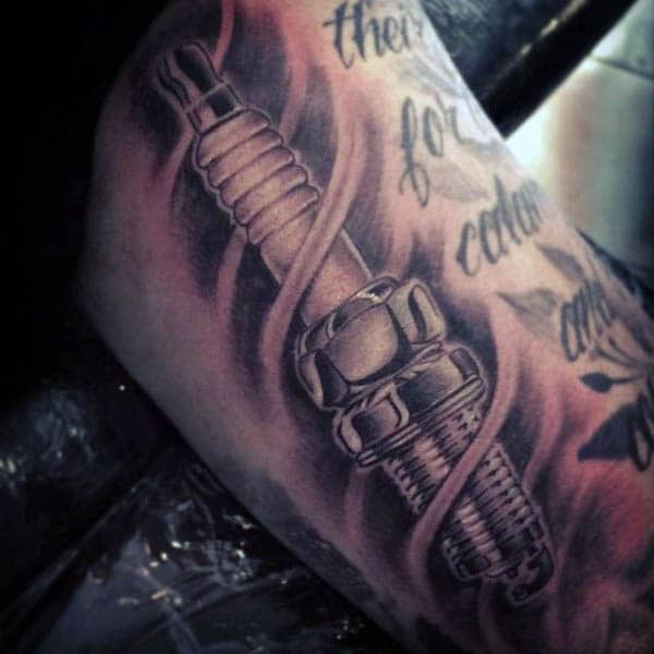 Guy With Spark Plug Shaded Bicep Tattoo