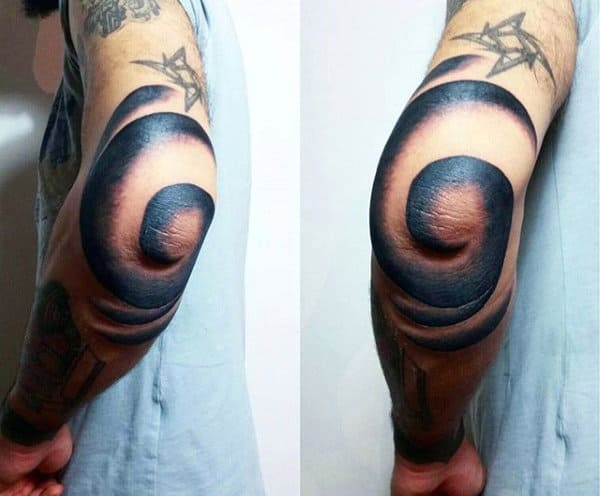 Guy With Spiral Elbow Tattoo In Blue Ink