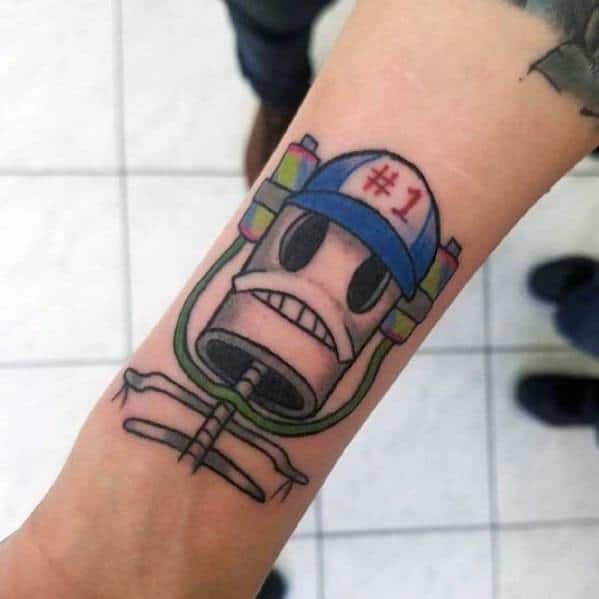 Tattoo of SpongeBob's plankton-controlled helmet with a #1 hat, bold lines and a quirky mechanical design on forearm.