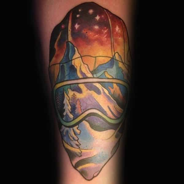 Guy With Starry Night And Snowboard Tattoo On Forearms