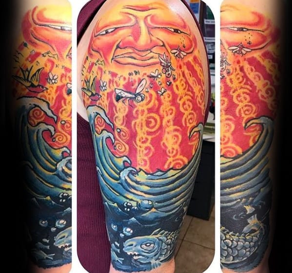 Full sleeve tattoo featuring a grinning sun face above fiery rays, crashing ocean waves, koi fish, and flying insects in bold colors.