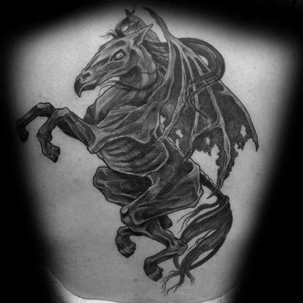 Large Thestral tattoo on the back showing the creature mid-rear with tattered wings and strong anatomical shading.