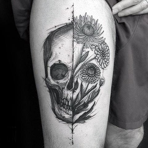 Guy With Thigh Tattoo Of Life Death Skull And Flowers